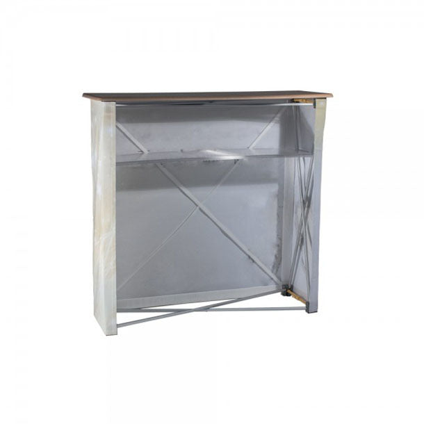 Textilfalttheke B 106 cm x H 102 x T 36 cm: Das weiße Faltthekengestell von hinten mit einer hellbraunen Holzplatte. Man sieht das Scherengittergestell und eine graue Ablagefläche in der Mitte, in Wiesbaden bei City Medien Einkaufswelt für Partner