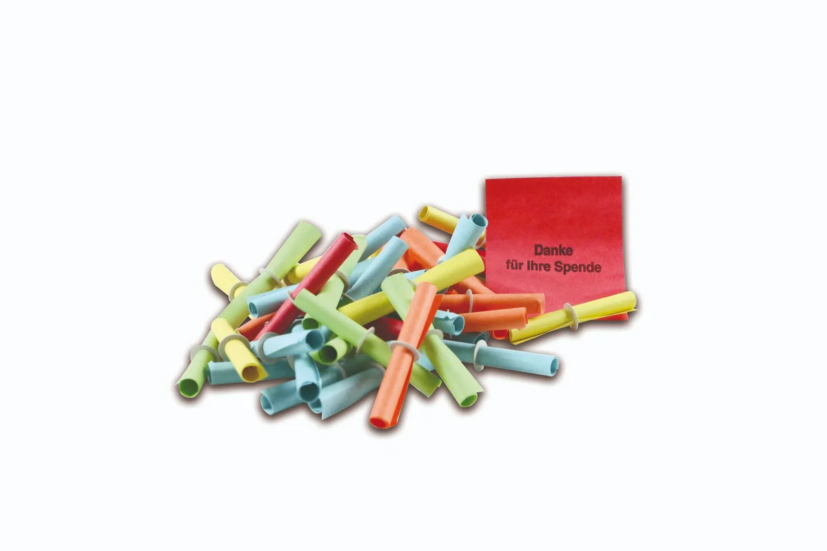 Röllchenlose Individualdruck – bunte Papierlose in Rot, Gelb, Grün und Blau mit Gummiring, aufgefaltet mit Text „Danke für Ihre Spende“, Nahaufnahme von Wiesbaden günstig kaufen, drucken lassen, online preiswert bestellen – Röllchenlose, Tombola, Gewinnspiele